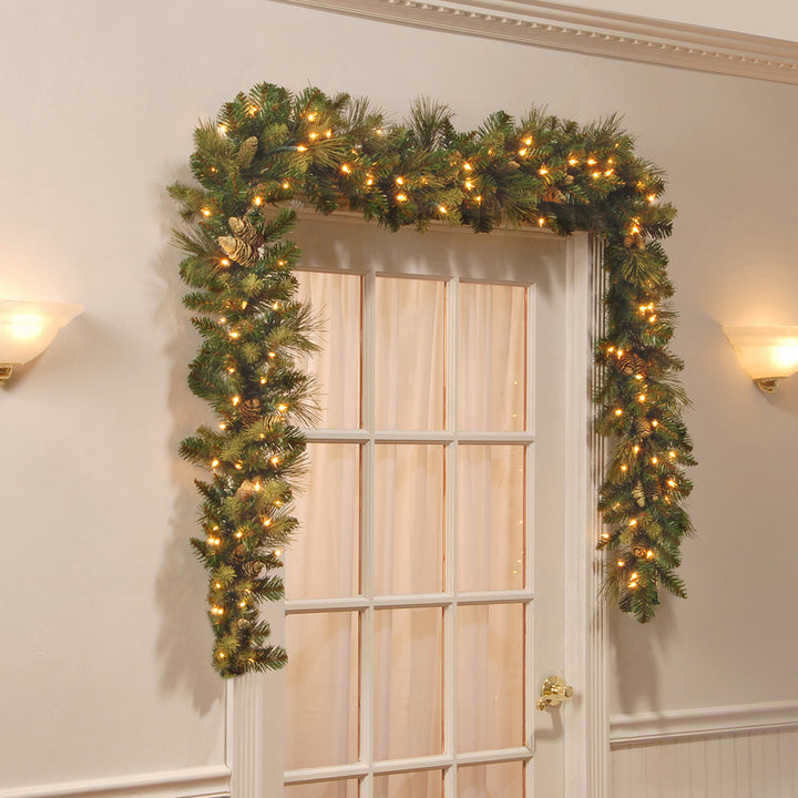 Pre Lit Artificial Garland, Carolina Pine, Green, Decorated with Pine Cones, White Lights, Plug In, Christmas Collection, 9 Feet