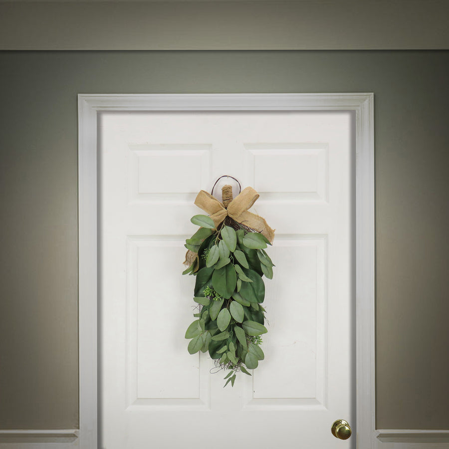 26 in. Spring Teardrop Wall Hanging Decoration with Eucalyptus Leaves, Magnolia Blooms, Flowing Green Stems