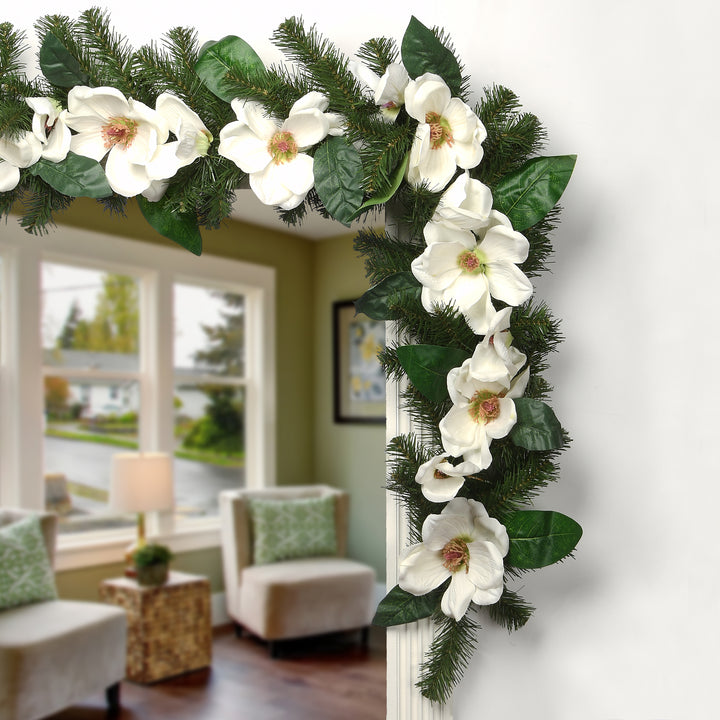 Artificial Garland North Valley Spruce, Green, Decorated with Magnolia Flower Blooms, 6 Feet