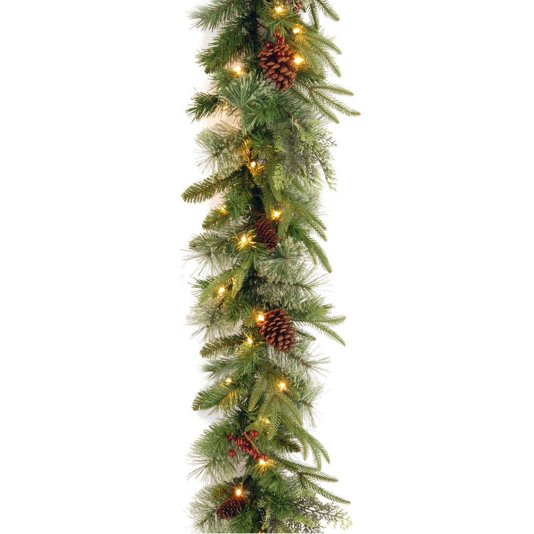 Pre-Lit 'Feel Real' Artificial Christmas Garland, Green, Colonial Fir, Multicolor Lights, Decorated With Pine Cones, Battery Operated, Christmas Collection, 9 Feet