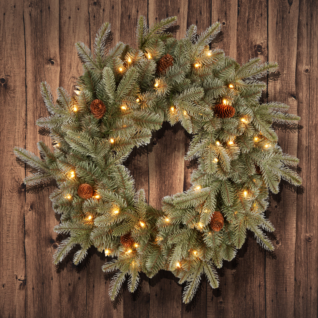 Pre-Lit Artificial 'Feel Real' Christmas Wreath, Green, Frosted Arctic Spruce, White Lights, Decorated with Pine Cones, Christmas Collection, 24 Inches