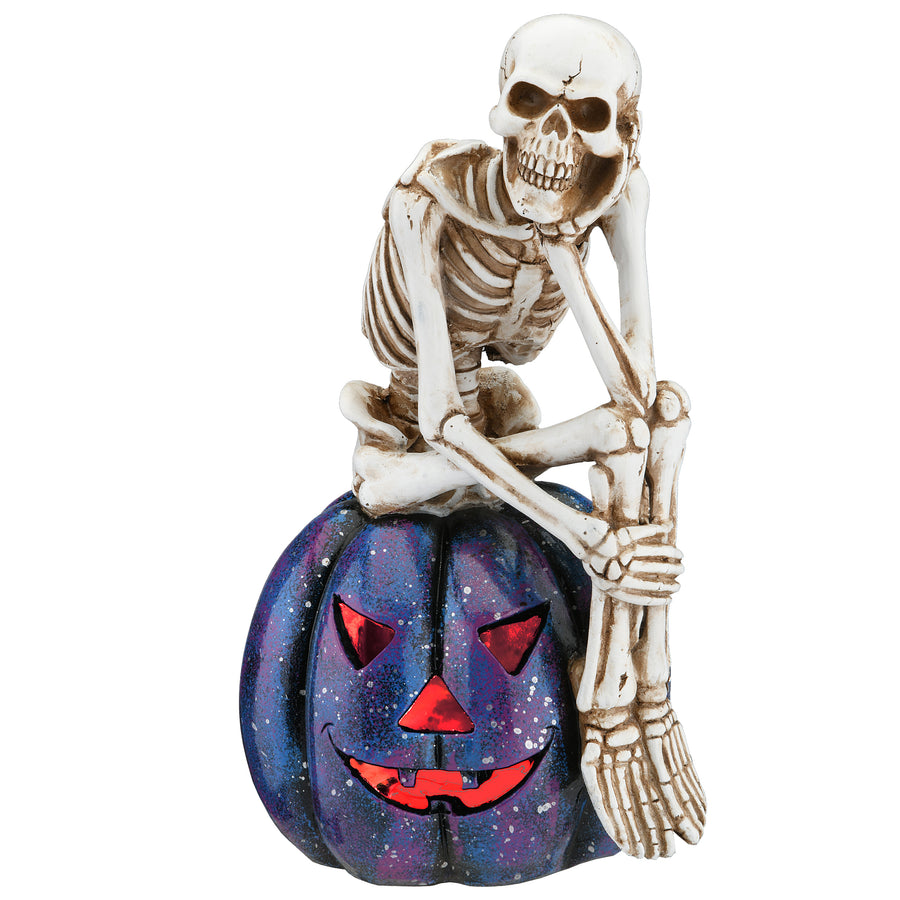 Halloween Skeleton Resting on a Purple Galaxy Jack O' Lantern, 11 Inches - National Tree Company