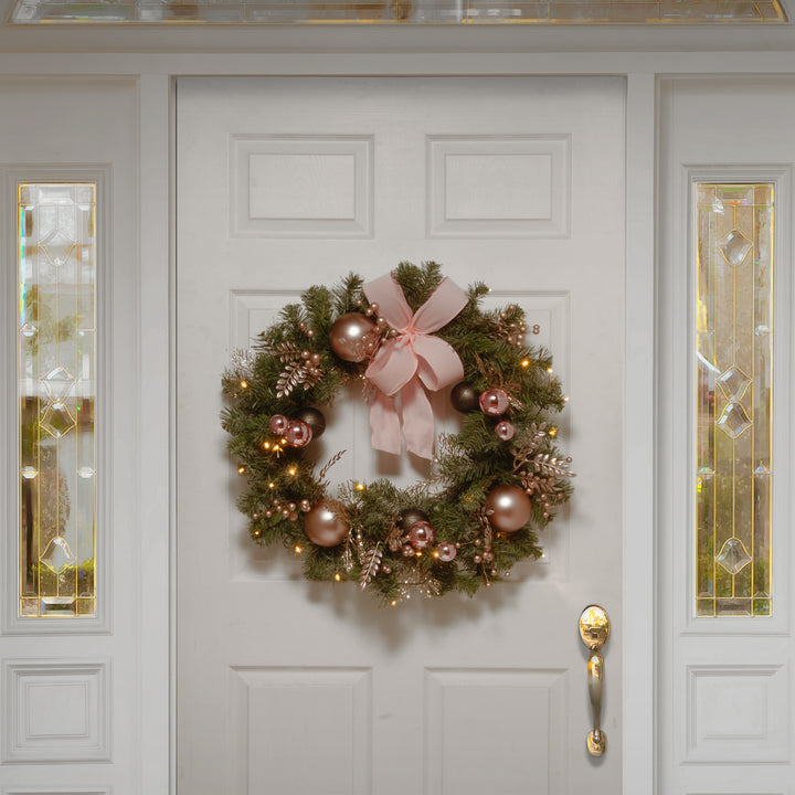National Tree Company Pre-Lit Artificial Christmas Wreath, Green, Bristle Berry Pine, White Lights, Decorated with Ball Ornaments, Pink Ribbon Bows, Twigs, Christmas Collection, 28 Inches