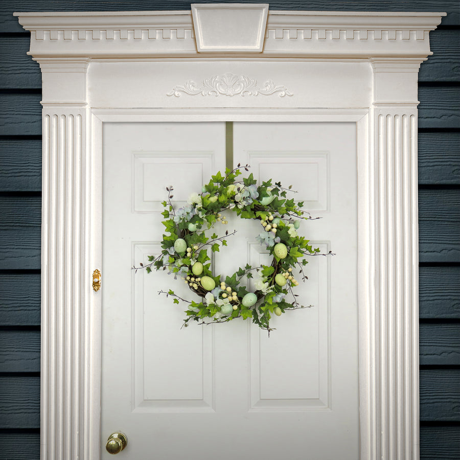 22 in. Easter Wreath Decorated with Pastel Eggs, Blue Flowers