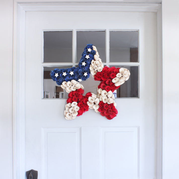 National Tree Company Patriotic Artificial Hanging Star Wreath Foam Base Decorated with Red White and Blue Flowers Stars 4th of July Collection 21 Inches