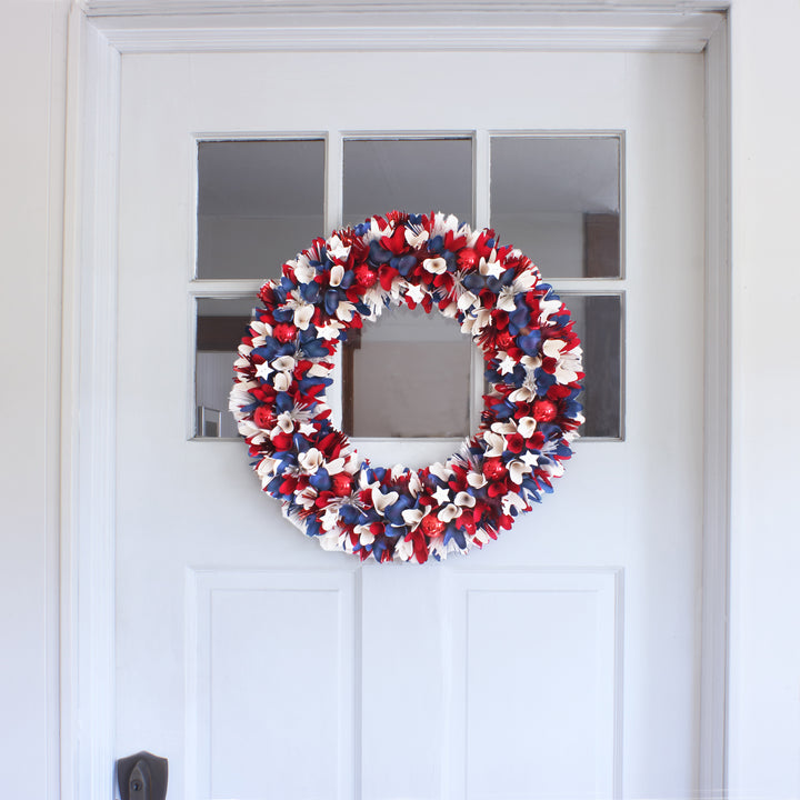 Patriotic Artificial Hanging Wreath Foam Base Decorated with Red White and Blue Flowers Petals Tinsel 4th of July Collection 21 Inches