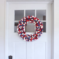 Patriotic Artificial Hanging Wreath Foam Base Decorated with Red White and Blue Flowers Petals Tinsel 4th of July Collection 21 Inches - National Tree Company