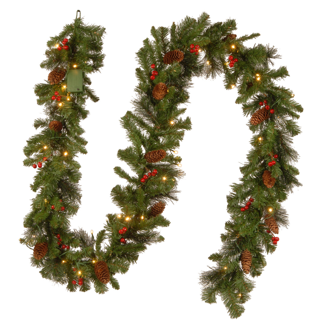 Pre-Lit Artificial Christmas Garland, Green, Crestwood Spruce, White Lights, Decorated with Pine Cones, Berry Clusters, Battery Operated, Christmas Collection, 9 Feet
