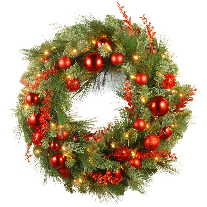 National Tree Company Pre-Lit Artificial Christmas Wreath, Green, Evergreen, White Lights, Decorated with Ball Ornaments, Red Sprigs, Christmas Collection, 30 Inches