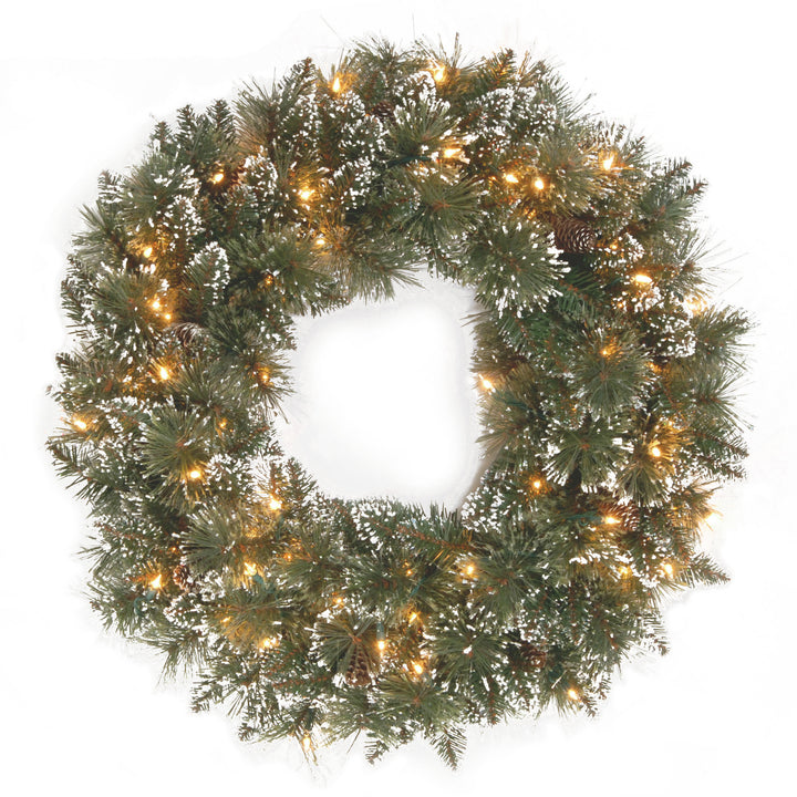Pre-Lit Artificial Christmas Wreath, Green, Glittery Bristle Pine, White Lights, Decorated with Frosted Branches, Pine Cones, Christmas Collection, 24 Inches