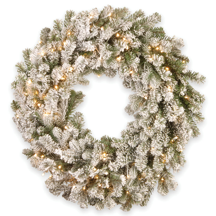 Pre-Lit 'Feel Real' Artificial Christmas Wreath, Green, Snowy Sheffield Spruce, White Lights, Decorated with Frosted Branches, Christmas Collection, 24 Inches